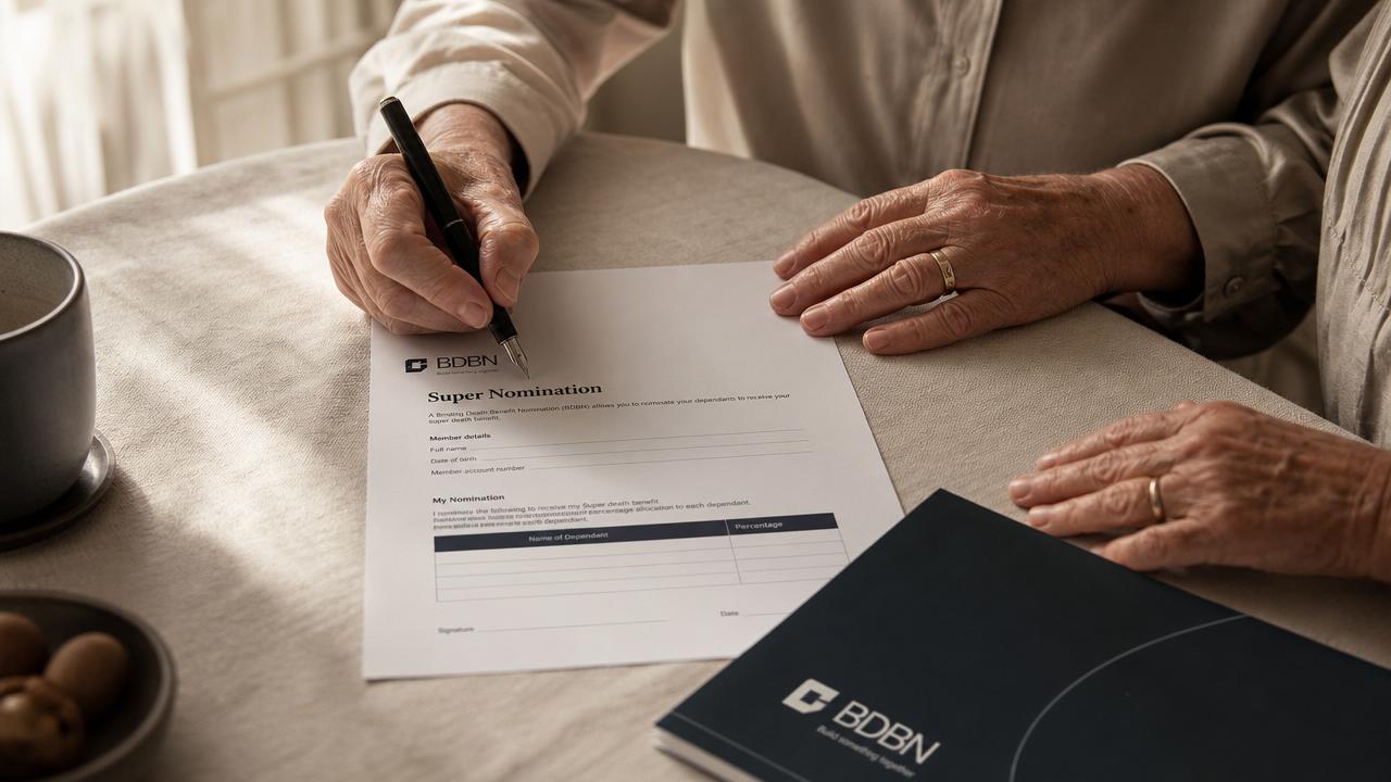 An older couple's hands signing a BDBN super nomination form in warm morning light